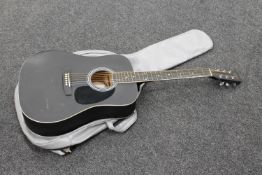 An Encore acoustic guitar in soft case