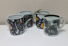 Four large Royal Copenhagen faience mugs, height 11.