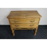 A blond oak two drawer chest