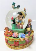 A Disney Pinocchio musical snow globe insert only