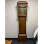 An antique oak longcase clock with later movement with brass dial signed John Mercer