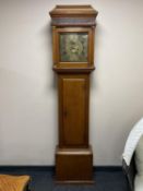 An antique oak longcase clock with later movement with brass dial signed John Mercer