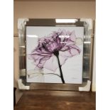 All glass framed picture depicting a flower,