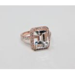 A 14ct rose gold aquamarine and diamond cluster ring,