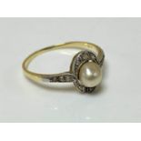 A 14ct yellow gold natural pearl and diamond ring, size N.