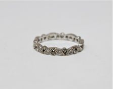 A white gold diamond set full eternity ring,