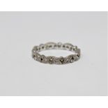 A white gold diamond set full eternity ring,