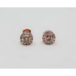 A pair of 14ct rose gold diamond cluster earrings,