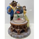 A Disney Beauty & The Beast musical and light up snow globe in original box