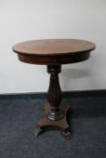 A 19th century oval mahogany work table