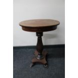 A 19th century oval mahogany work table