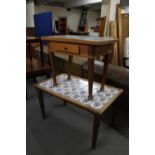 A mid 20th century pine tiled topped coffee table and a side table