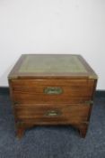 A ship's style two drawer chest with inset leather panel