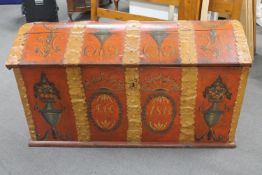 A 19th century hand painted domed topped shipping trunk with key with metal fittings