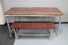 A reclaimed wood and scaffold board table and bench set