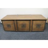 An early twentieth century oak bedding box with metal hinges