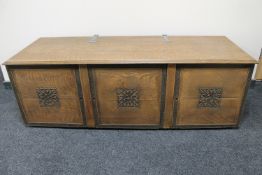 An early twentieth century oak bedding box with metal hinges