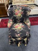 A mid twentieth century bedroom chair upholstered in a floral fabric