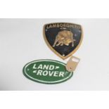 Two cast iron signs : Land Rover and Lamborghini