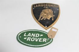 Two cast iron signs : Land Rover and Lamborghini