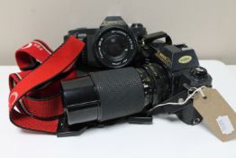 Two Canon T50 cameras with zoom lens