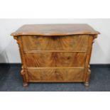 A 19th century continental mahogany three drawer chest with serpentine top