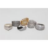 Six silver dress rings