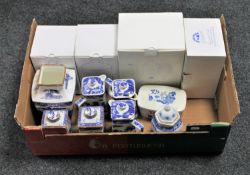 A box of Ringtons china : willow pattern coffee pots, storage jars, butter dishes,