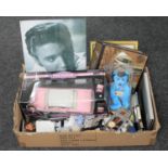 A box of Elvis Presley memorabilia to include a die cast pink Cadillac, playing cards,