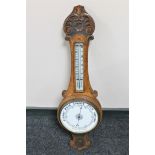 An Edwardian oak aneroid barometer