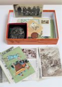 A box of WWI era postcards including military, loose stamps, St.