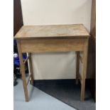 A teak clerk's desk on raised legs