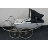 A mid 20th century Silver Cross coach built doll's pram