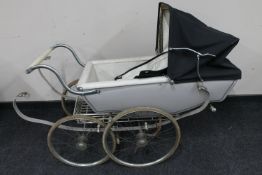 A mid 20th century Silver Cross coach built doll's pram