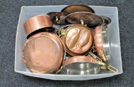 A box of antique copper and brass handled pans and frying pans,