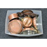 A box of antique copper and brass handled pans and frying pans,