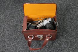 A Mamiya DSX 1000 camera and a Zenit E camera and Sigma lens in carry case