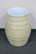 An early 20th century glazed pottery flour barrel