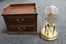 An Edwardian mahogany counter top two drawer chest and a German Kunda brass anniversary clock under