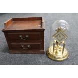 An Edwardian mahogany counter top two drawer chest and a German Kunda brass anniversary clock under