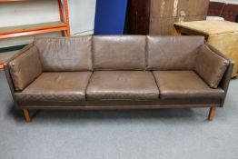 A mid 20th century Danish brown leather three seater settee