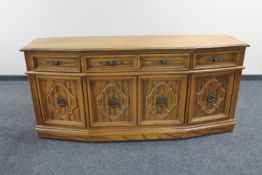 A contemporary American style shaped fronted sideboard