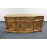 A contemporary American style shaped fronted sideboard