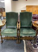 An early twentieth century oak scroll arm chairs upholstered in green dralon