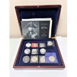 A coin box containing twelve coins - Crowns, Battle of Trafalgar, Victory,