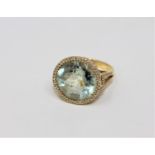 An 18ct gold green amethyst and diamond cluster ring,