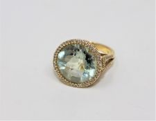 An 18ct gold green amethyst and diamond cluster ring,