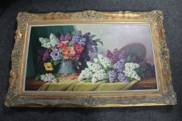 A 20th century oil on canvas depicting still life with flowers