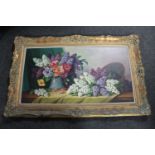 A 20th century oil on canvas depicting still life with flowers