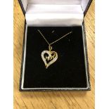 A 10ct gold diamond set 'Mom' pendant on chain